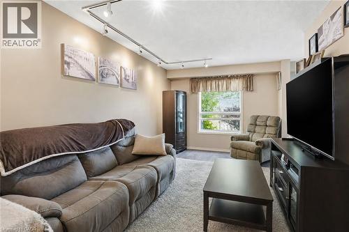 Virtually Staged - 565 Rymal Road E Unit# 2, Hamilton, ON - Indoor Photo Showing Living Room