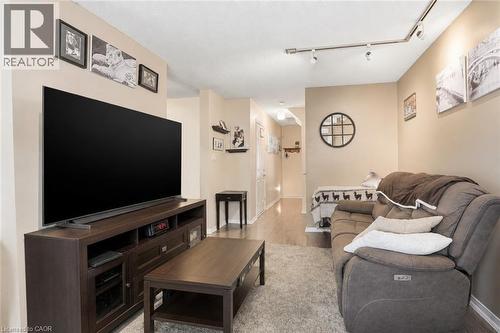 Virtually Staged - 565 Rymal Road E Unit# 2, Hamilton, ON - Indoor Photo Showing Living Room
