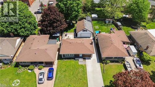 Single-story home featuring a brown shingle roof, light-colored siding, and a paved driveway - 158 Plymouth Road, Kitchener, ON - Outdoor