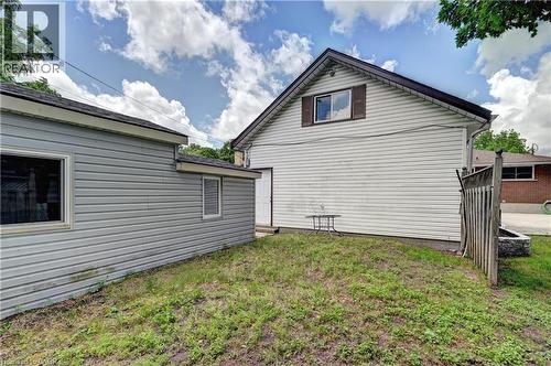 Two distinct structures featuring horizontal siding - 158 Plymouth Road, Kitchener, ON 