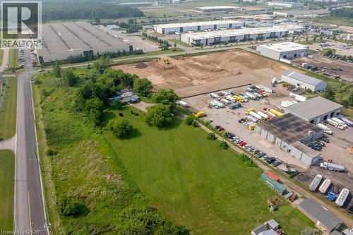 Expansive industrial property featuring a large cleared lot and multiple warehouse structures - 1264 Parkinson Road, Woodstock, ON 