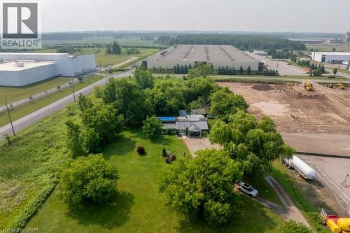 Expansive lot featuring a single-story residence, mature trees, and a pool - 1264 Parkinson Road, Woodstock, ON 
