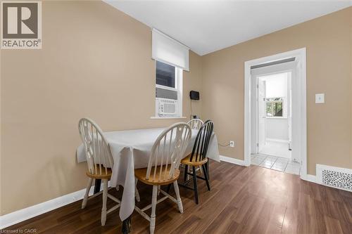 Interior room with wood-finish flooring and neutral-toned walls - 205 Ferguson Avenue S, Hamilton, ON - Indoor Photo Showing Dining Room
