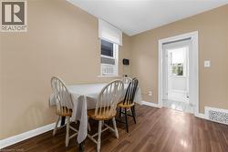 Interior room with wood-finish flooring and neutral-toned walls - 