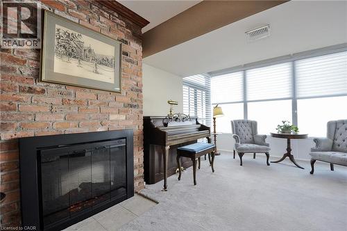 237 King Street W Unit# 1305, Cambridge, ON - Indoor Photo Showing Living Room With Fireplace