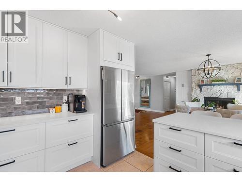 1659 Scott Crescent, Kelowna, BC - Indoor Photo Showing Kitchen With Fireplace