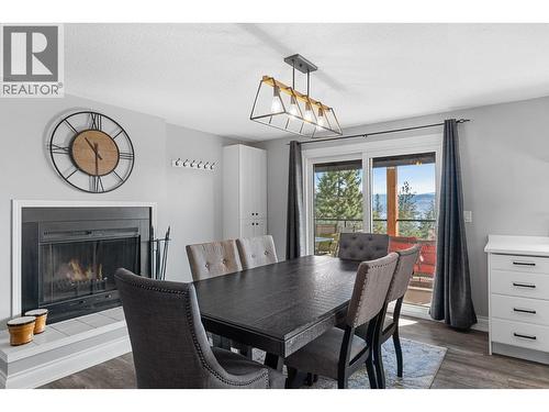 1659 Scott Crescent, Kelowna, BC - Indoor Photo Showing Dining Room With Fireplace