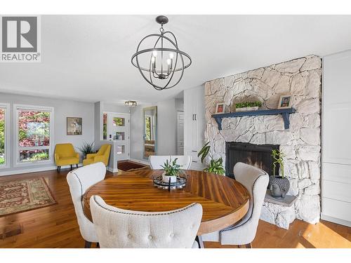 1659 Scott Crescent, Kelowna, BC - Indoor Photo Showing Dining Room With Fireplace