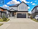 Contemporary two-story residence featuring a stucco and stone facade - 63 Ian Ormston Drive, Kitchener, ON  - Outdoor With Facade 