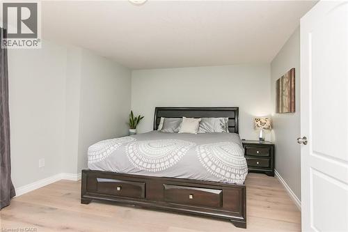 Bedroom featuring light-toned wood-finish flooring and light gray painted walls - 529 Chesapeake Crescent, Waterloo, ON - Indoor Photo Showing Bedroom