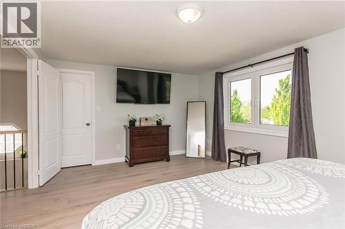 Spacious room featuring light wood-finish flooring and a double window - 529 Chesapeake Crescent, Waterloo, ON - Indoor Photo Showing Bedroom