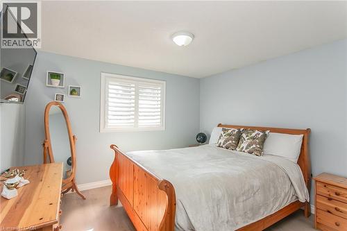 Interior room with light wood-finish flooring and light blue wall paint - 529 Chesapeake Crescent, Waterloo, ON - Indoor Photo Showing Bedroom