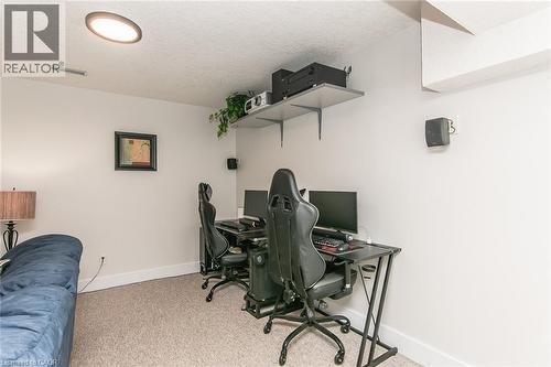 Carpeted room featuring light-toned walls, recessed ceiling lighting, and wall-mounted shelving - 529 Chesapeake Crescent, Waterloo, ON - Indoor Photo Showing Office