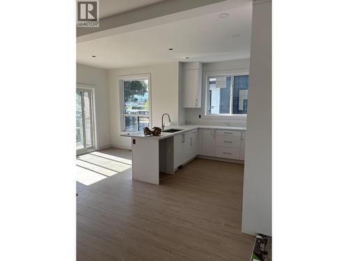Main floor kitchen and Dining - 980 Franklyn Road Unit# 3 Lot# 3, Kelowna, BC 