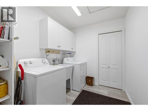 Dedicated laundry space designed for practicality and storage. - 2250 Louie Drive Unit# 69, Westbank, BC - Indoor Photo Showing Laundry Room