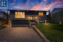 Split-level residence featuring dark siding and stone accents - 44 Oakhurst Crescent, Kitchener, ON  - Outdoor 