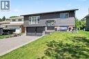 Modern split-level residence featuring dark gray siding and stone accents - 44 Oakhurst Crescent, Kitchener, ON  - Outdoor 