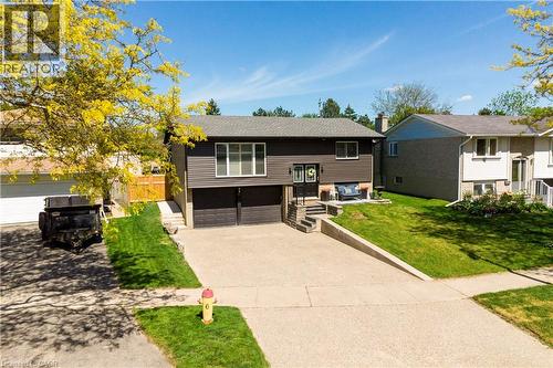 Split-level residence featuring dark siding and a concrete driveway - 44 Oakhurst Crescent, Kitchener, ON - Outdoor