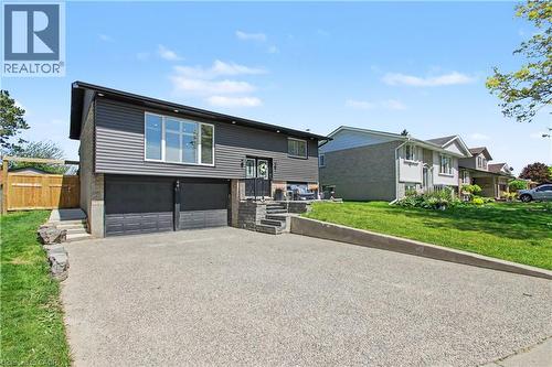 Split-level residence featuring a gray siding and brick exterior - 44 Oakhurst Crescent, Kitchener, ON - Outdoor