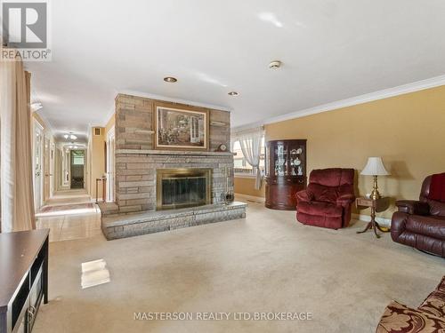 5 Burdy Drive, St. Catharines (Grapeview), ON - Indoor Photo Showing Living Room With Fireplace