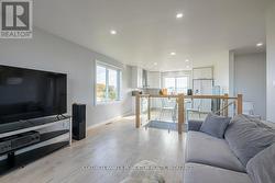 OPEN CONCEPT UPPER LIVINGROOM WITH UPPER KITCHEN - 