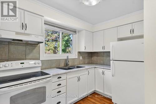 121 - 1095 Mississaga Street W, Orillia, ON - Indoor Photo Showing Kitchen With Double Sink