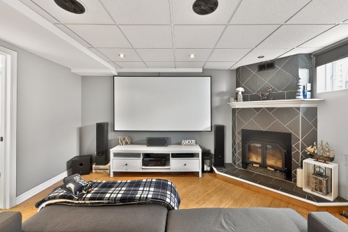 Cinéma maison - 47 Rue Marcel-Vidal, Blainville, QC - Indoor Photo Showing Living Room With Fireplace