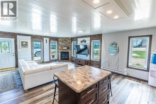 11 Sunrise Boulevard, Arm Lake, SK - Indoor Photo Showing Living Room With Fireplace