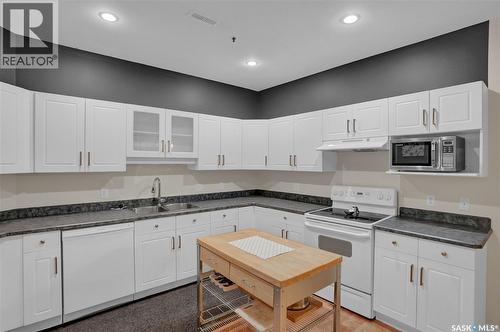 208 1901 Victoria Avenue, Regina, SK - Indoor Photo Showing Kitchen With Double Sink