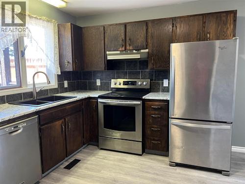505 97A Avenue, Dawson Creek, BC - Indoor Photo Showing Kitchen With Double Sink