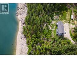Drone Photo of Property that shows trail down to beachfront and Lake. - 