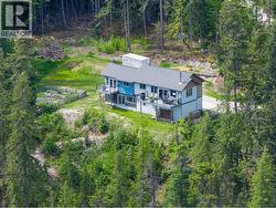 Drone View of Side and Back of House that faces Lake and Mountains. - 