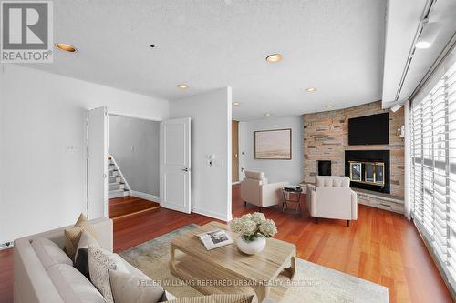 7 Harlock Boulevard, Toronto, ON - Indoor Photo Showing Living Room With Fireplace