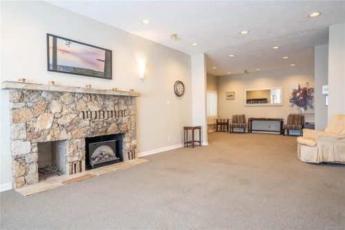 #306-5110 Cordova Bay Rd, Saanich, BC - Indoor Photo Showing Living Room With Fireplace