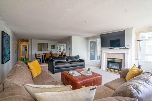 #306-5110 Cordova Bay Rd, Saanich, BC - Indoor Photo Showing Living Room With Fireplace