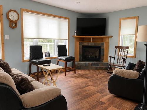 6086 Hwy 11/71, Emo, ON - Indoor Photo Showing Living Room With Fireplace