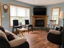 6086 Hwy 11/71, Emo, ON  - Indoor Photo Showing Living Room With Fireplace 