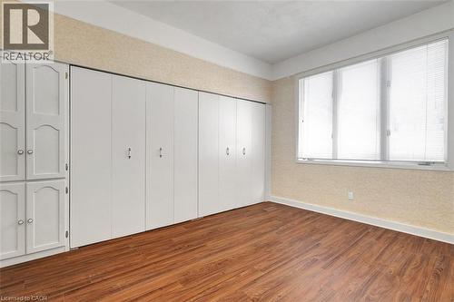 Expansive wall of built-in cabinetry and closet storage, featuring white panel doors and brushed nickel hardware - 14 Niagara Street, Hamilton, ON 