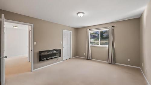 26-7915 Hespeler Road, Summerland, BC - Indoor Photo Showing Other Room With Fireplace
