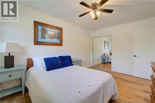 Interior room featuring wood-finish flooring and a ceiling fan with integrated lighting - 251 Union Street E, Waterloo, ON 