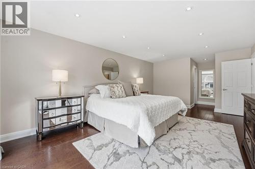Bedroom with dark wood-type flooring and recessed lighting - 28 Deerview Avenue, Ancaster, ON 