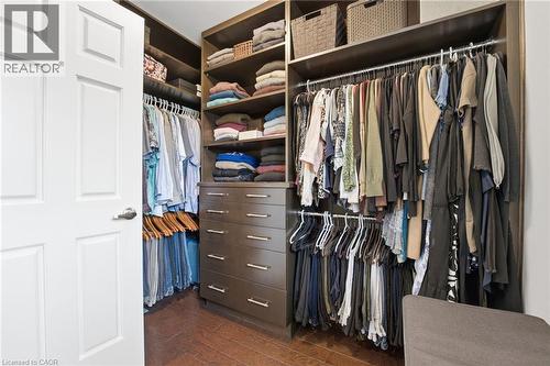 Walk in closet with dark wood finished floors - 28 Deerview Avenue, Ancaster, ON 