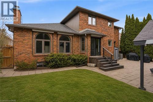 Red brick exterior with a multi-level design - 28 Deerview Avenue, Ancaster, ON 