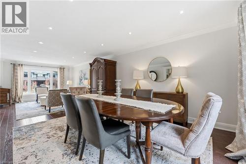 Dining space with wood-type flooring, crown molding, and recessed lighting - 28 Deerview Avenue, Ancaster, ON 