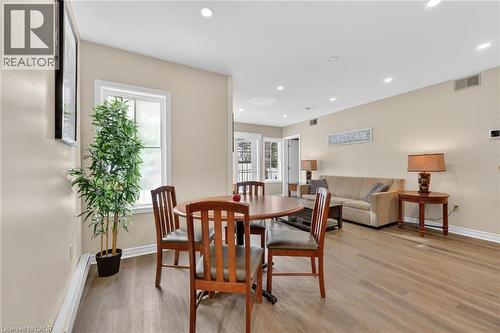 Dining space with recessed lighting, light wood-type flooring, and a baseboard heating unit - 90 Highland Drive Unit# 2014/15, Simcoe, ON 