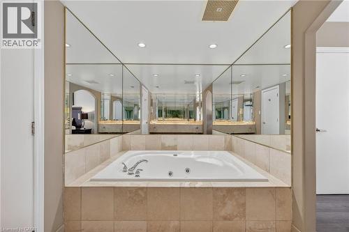 Bathroom with a jetted tub and recessed lighting - 90 Highland Drive Unit# 2014/15, Simcoe, ON 