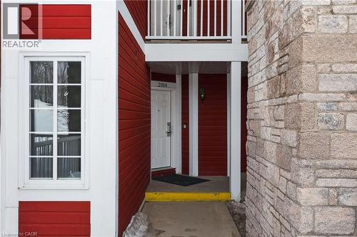 View of exterior entry with stone siding - 90 Highland Drive Unit# 2014/15, Simcoe, ON 