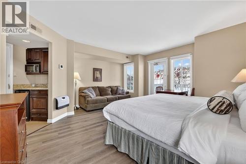 Bedroom featuring light wood finished floors and heating unit - 90 Highland Drive Unit# 2014/15, Simcoe, ON 