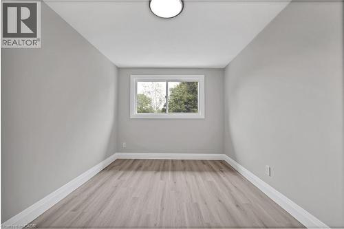 Neutral gray walls, wood-finish flooring, and white trim - 71 Blucher Street Unit# G, Kitchener, ON 