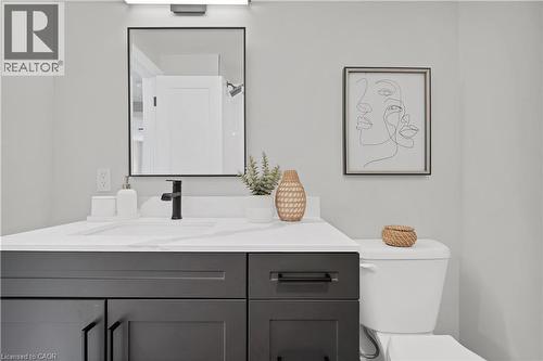 Modern bathroom vanity featuring a white countertop with integrated sink - 71 Blucher Street Unit# G, Kitchener, ON 